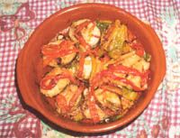 receta de Merluza a la Bilbana con pimientos rojos.